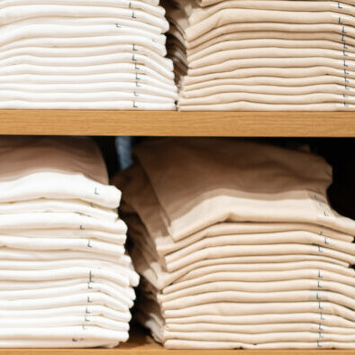 blank-apparel-on-shelves-2629335501-crop1